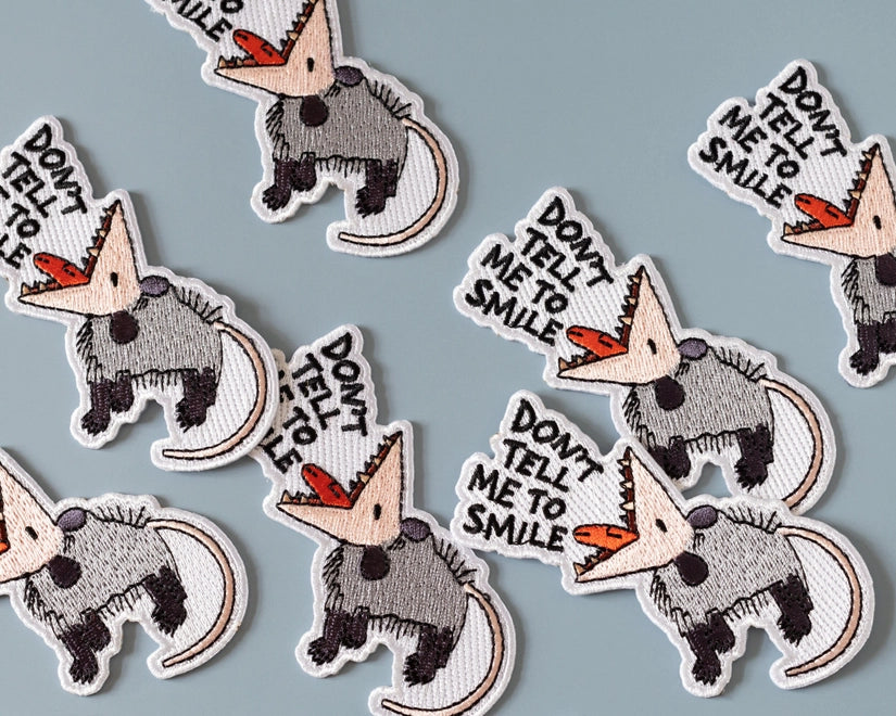 #73 Don't Tell Me to Smile Possum Iron-On Patch