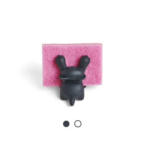 Black bunny-shaped sponge holder on a pink sponge with a white background