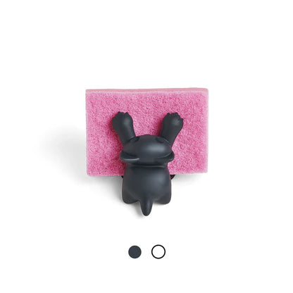 Black bunny-shaped sponge holder on a pink sponge with a white background